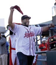 Go Squirrels! // Former Pittsburgh Steelers’ star running back Jerome “The Bus” Bettis waves a towel to stir up the crowd after throwing out the ceremonial first pitch Thursday night. 
