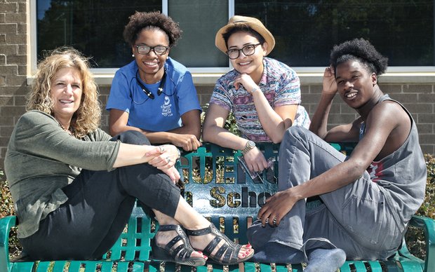 
Dr. Natalie May, left, holds an impromptu meeting with three Change the World RVA students. From left, they are Marshé Turner, Leo Reyes and Vincente Johnson. Location: Huguenot High School in South Side. 