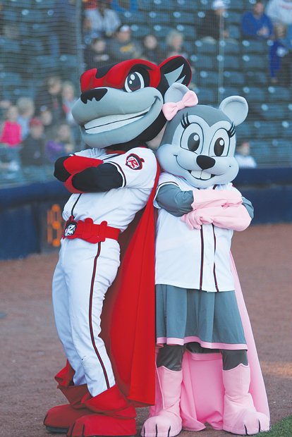 Go Squirrels! //
The Richmond Flying Squirrels and their entertainment guru, vice president and COO Todd “Parney” Parnell, provided lots of reasons to cheer for the thousands of fans who attended the minor league baseball team’s official home opening games last Thursday and Friday against the Altoona Curve at The Diamond. The team’s newest mascot, Nutasha, right, cozies up to longtime mascot Nutzy.