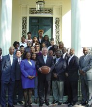 Gov. Terry McAuliffe, center, welcomes the Virginia Union University Lady panthers basketball team to the Governor’s Mansion on Tuesday. Flanking him are VUU head Coach AnnMarie Gilbert and Athletic Director Joe Taylor. Division II player of the Year Kiana Johnson (wearing eyeglasses) is behind Coach Gilbert.