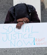 Timothy Quarles joined others at the predominately youth-led rally that called on city leaders to keep the shelter on a year-round basis and to improve the conditions there.