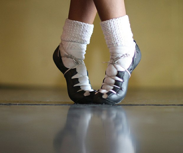 Morgan Bullock poses in front of a mirror during a recent practice. She shows off the special shoes she uses to perform the fast-paced Irish dance routines.