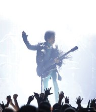 Prince performs in front of adoring fans at the Billboard Music Awards on May 19, 2013. Location: The MGM Grand Garden Arena in Las Vegas. 