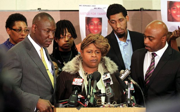 Samaria Rice, center, the mother of 12-year-old Tamir Rice, speaks during a December 2014 news conference about her son, who was shot and killed by Cleveland police while playing in a park. With Mrs. Rice are attorney Benjamin Crump, left; Tamir’s father, Leonard Warner, second from right; and attorney Walter Madison, right.