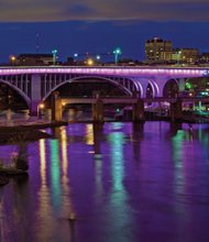 Purple lights adorn a bridge on Interstate 35 in Minneapolis-St. Paul in honor of Prince, one of many structures in the country and around the world lighted in tribute to the “Purple Rain” star.