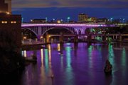 Purple lights adorn a bridge on Interstate 35 in Minneapolis-St. Paul in honor of Prince, one of many structures in the country and around the world lighted in tribute to the “Purple Rain” star.