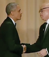 President Obama greets comedian Larry Wilmore after the “Comedy Central” host ended last Saturday’s White House Correspondents’ Association Dinner with remarks that later drew criticism.