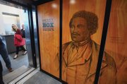 Visitors get a first look and touch of the new interactive displays installed at the Black History Museum Cultural Center of Virginia during a media tour last week. The screens are positioned throughout the museum, which also features a 55-inch touch table.  