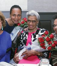 Remembering Richmond’s first black police officers // Lillian Randolph, center, accepts a bouquet of roses Saturday during a dinner commemorating the 70th anniversary of the hiring of the first African-American police officers in Richmond.
Mrs. Randolph’s late husband, Frank S. Randolph, was among the four first officers hired by the city and remembered at the event at a Downtown hotel attended by 150 people.
The other trailblazing officers honored were John W. Vann, Doctor P. Day and Howard T. Braxton. They were hired May 1, 1946.
Richmond Police ChiefAlfred Durham gave the keynote address, while Mayor Dwight C. Jones offered remarks. With Mrs. Randolph are her daughters, Patricia Randolph Myers, left, and Renda Randolph, right.
The event was organized by Richmond Police Sgt. Carol D. Adams, second from left, and sponsored by the Richmond Black Police Officers Association and Engine Company #9.