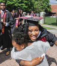 So proud! //
Christine Turner of Chesapeake gets a huge hug of congratulations from her niece, Nijah Roberson, as she and other Virginia Union University candidates for graduation march toward Hovey Field last Saturday for the commencement ceremony. 