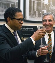 Dr. Monroe E. Harris Jr. and Hossein Sadid, BHM board members, toast to a successful opening. Board Co-chair Bessida Cauthorne White and Chairwoman Marilyn H. West helped lead the multimillion-dollar project. Elijah Crawley, 12, an Elko Middle School student and son of museum director Tasha Chambers, learns firsthand from former Gov. L. Douglas Wilder.
