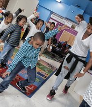 Be a lion //
Mykal Ashlee, a cast member of the popular musical “Disney’s The
Lion King,” teaches dance moves to children at the Child Development Center at Greater Brook Road Baptist Church, 4208 Chamberlayne Ave. He stopped by last Friday to work with children, just two days before the traveling musical ended its run at the Altria Theater on Sunday.