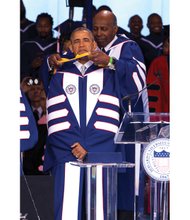 
President Obama is hooded by attorney Vernon E. Jordan, a member of Howard University’s Board of Trustees, as he receives an honorary doctor of laws degree during the Washington institution’s graduation ceremonies last Saturday.