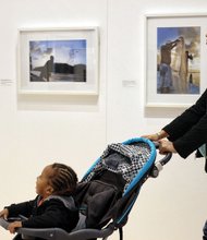 Shenelle Reed strolled with her year- old son, Ka’Leel, who was engrossed in the portraits of Yemaya by Arturo Lindsay