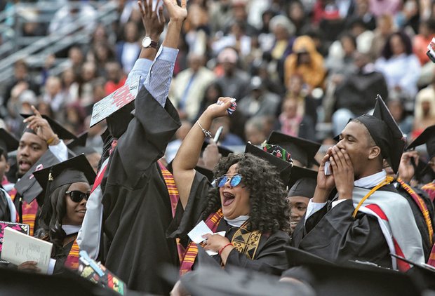 VUU graduates wave to family and friends at Hovey Field.