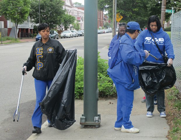 Members of the National Pan-Hellenic Council of Metro Richmond — a coalition of the nine historically African-American fraternities and sororities — pick up litter in Jackson Ward on a recent weekend. Similar community spring-cleaning efforts have been taking place across the area. Last weekend, for example, volunteers cleaned up alleys in Barton Heights, while others spent time clearing growth from four African-American burial grounds located on the border between Richmond and Henrico County.