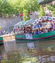 ¿Que Pasa? Richmond //
A colorful canal boat provides free rides to participants at the ¿Que Pasa? Festival, which translates to “what’s happening.” Organizers of the festival last weekend in Downtown used decorations to transform the Canal Walk into a semblance of the Floating Gardens of Xochimilco in Mexico City. The event featured music, dance, food, drink and arts and crafts celebrating Latin American culture.