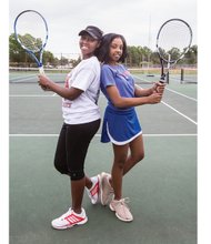 Armstrong High School tennis standouts Sharvae Ward, left, and Jazmine Davis are playing conference matches this week, where Davis has been undefeated the last two years.