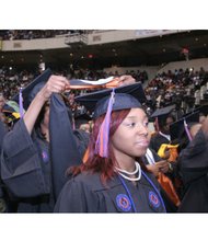 More than 600 degrees were conferred, with Morgan Pollard of Charlotte, N.C., below left, earning the distinction of having the highest GPA of the Class of 2016 with a perfect 4.0. Below, Brianna Williams and Justin Williams are “hooded” during the ceremony held at the Richmond Coliseum in Downtown.