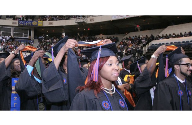 More than 600 degrees were conferred, with Morgan Pollard of Charlotte, N.C., below left, earning the distinction of having the highest GPA of the Class of 2016 with a perfect 4.0. Below, Brianna Williams and Justin Williams are “hooded” during the ceremony held at the Richmond Coliseum in Downtown.