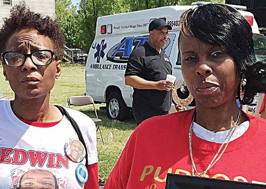 Johneece Cobb (left) and Debra Butler are joined by Butler’s daughter to honor the memory of loved ones lost to gun violence. Cobb lost her 19-year old nephew, Edwin Cook, to a random shooting in February 2015 while Butler lost her son, Jeffrey, in a July 2011 drive by shooting.