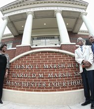 From left, Harold M. Marsh Jr. and Dr. Erica Marsh, the children of Harold M. Marsh Sr.; Henry L. Marsh III; and Richmond Mayor Dwight C. Jones stand in front of the new sign outside the courthouse at 920 Hull St. The South Richmond courthouse was renamed last Friday in honor of Mr. Marsh and his brother, Harold M. Marsh Sr., who died in 1997. 