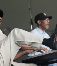 Keyboardist Mack Baker uses both hands and
one foot during his performance with Johnny Houston and Swagger