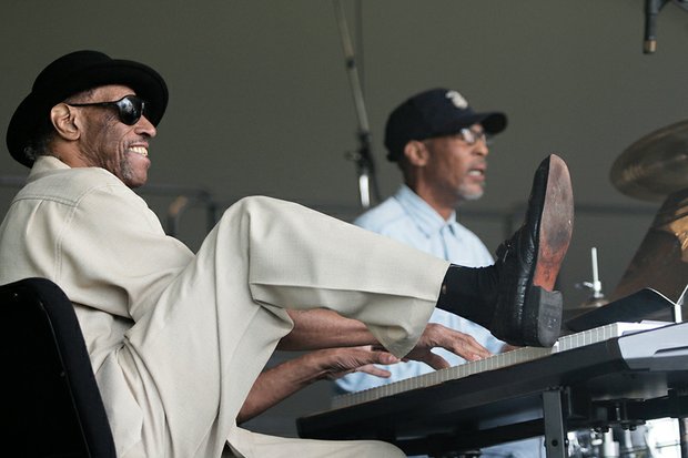 Keyboardist Mack Baker uses both hands and
one foot during his performance with Johnny Houston and Swagger