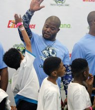 The future of the game // Former Seattle Seahawks fullback and Richmond native Michael Robinson returned home last weekend to host his annual football camp for football enthusiasts ages 8 to 16.
Scores of youngsters turned out for the event at Sports Reality Performance in Mechanicsville to learn tips from the pro himself, left, and several of his notable NFL friends who also worked with the youngsters.