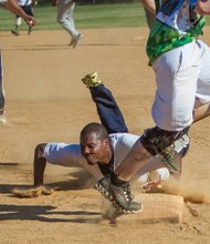 Kevin Rather of the Richmond-based Cooke’s-Allen softball team slides to tag the bag to get a runner out during last Saturday’s game against BTA at the SoftballNation N.I.T. Beast of the East tournament.