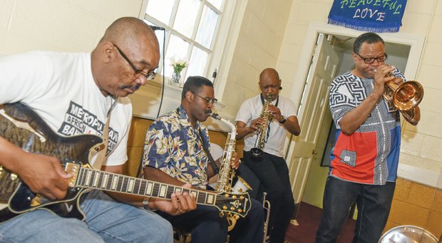 MetroPosse members, James Edmonds, Neal Bowens, Del Rogers and Percy Minor perform during the Jazz on the Lawn celebration honoring Dr. Cooper.