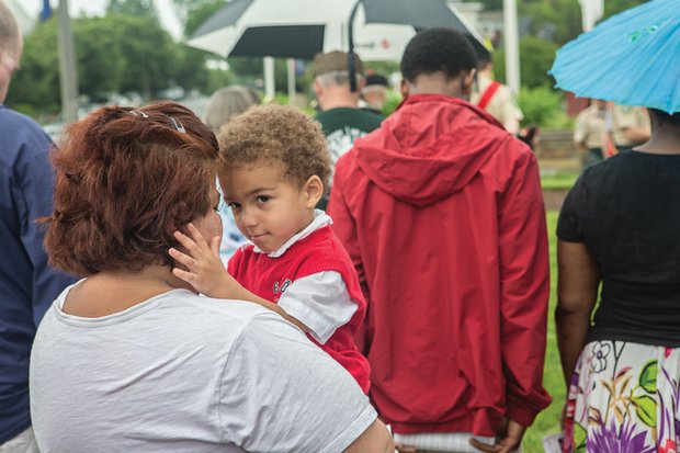 Memorial Day weekend 2016 // Between the sun and the showers, Memorial Day weekend was a time for reflection and remembrance of family members who have died and those in the military who have made the ultimate sacrifice. Hundreds of people attended the 60th Annual Memorial Day Ceremony sponsored by the Commonwealth of Virginia and American Legion District 11 at the Virginia War Memorial on South Belvidere Street in Richmond.

Shane Paris Kennedy, 3, in the arms of his mother, Diana Kennedy, at Monday’s ceremony at the Virginia War Memorial. Below left, the eternal flame burns at the feet of the statue of Memory. Flowers and a flag adorn a crypt in the mausoleum at Forest Lawn Cemetery in Henrico County.