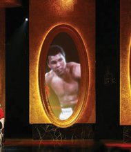 
Mr. Ali, accompanied by his wife Lonnie, accepts the President’s Award at the 40th Annual NAACP Image Awards in February 2009.