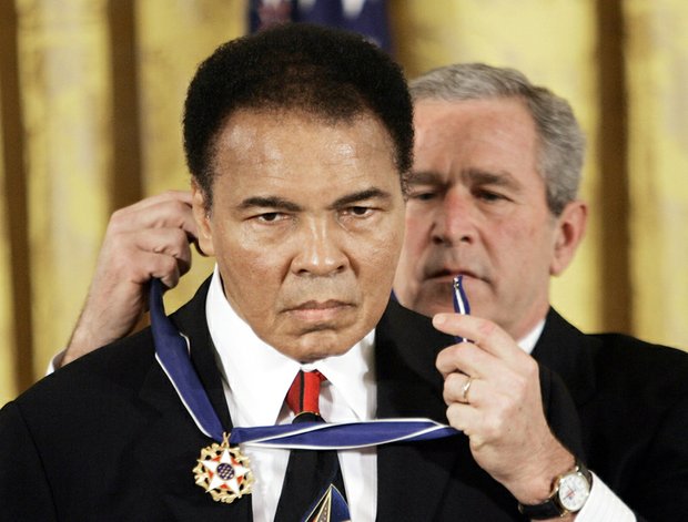 President George W. Bush awards the Medal of Freedom to Mr. Ali at a White House ceremony in November 2005. 