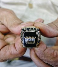 Former Gov. L. Douglas Wilder holds the championship ring that Muhammad Ali gave him when he became the nation’s first elected African-American governor in 1989.