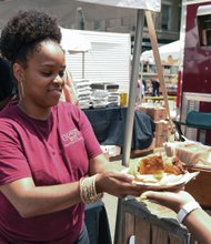 Appetite for Appétit //

Natasha Wilson of Croaker’s Spot serves an eager customer during Sunday’s Broad Appétit, an annual food fest on the main street through Downtown. Hundreds of people enjoyed a variety of dishes from local restaurants during the $3-a-plate smorgasbord spanning four blocks on East Broad Street between Henry and Adams streets. Art, music and vendors also lured festivalgoers to the event hosted by the Downtown Neighborhood Association. Proceeds benefit FeedMore, a Central Virginia hunger-relief organization. 

