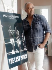 Petersburg resident Jesse Vaughan displays poster art from “The Last Punch,” the feature film he directed about Muhammad Ali’s final fight.
