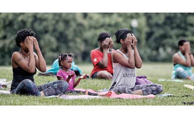 
Namaste //
Kailee Lundy, 5, center, discovers her inner yogi during “Yoga and More in the Park” Saturday at Chimborazo Park. The youngster was flanked by her mother, Ashlee Boyd, left, and aunt, Asantewoa Fitzgerald, right, who also participated in the weekly yoga practice. The free sessions, which will continue at 10 a.m. on Saturdays through the summer, are part of the Desert Canvas Network, a community movement to help people step outside their comfort zones, face their fears and become who they want to be, according to its organizers. 