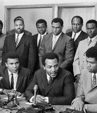 
Sports stars take part in the 1967 “Ali Summit” in Cleveland to show support for the boxing champ’s refusal to be drafted. Mr. Ali, seated second from left, was joined by, seated from left, Bill Russell, Boston Celtics; Jim Brown, Cleveland Browns, and then college star Lew Alcindor Jr., later L.A. Lakers great Kareem Abdul-Jabbar. Standing from left: Ohio Congressman Carl Stokes; Walter Beach, Cleveland Browns; Bobby Mitchell, Washington NFL team; Sid Williams, Cleveland Browns; Curtis McClinton, Kansas City Chiefs; Willie Davis, Green Bay Packers; Jim Shorter, former Cleveland Browns player and John Wooten, Cleveland Browns.