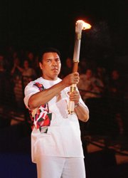 Muhammad Ali holds the Olympic torch as he prepares to light the flame and open the 1996 games in Atlanta.