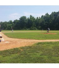 Prince George Blue Sox pitcher Marquis Johnson winds up for a throw during last Sunday’s game in Disputanta against the Dinwiddie County Giants. Johnson is a student at St. Augustine’s University in Raleigh, N.C.