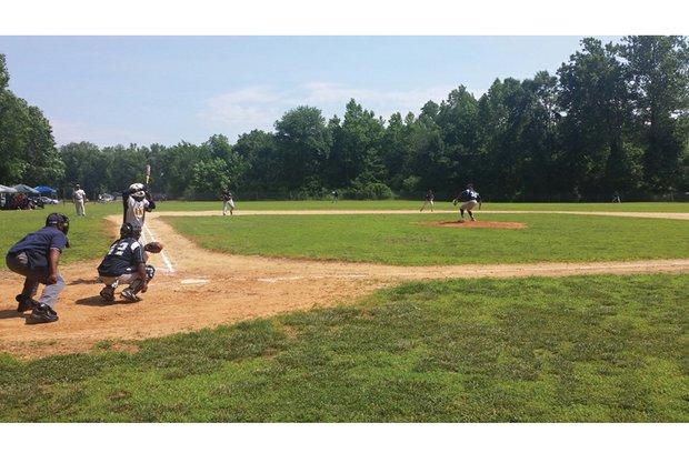 Prince George Blue Sox pitcher Marquis Johnson winds up for a throw during last Sunday’s game in Disputanta against the Dinwiddie County Giants. Johnson is a student at St. Augustine’s University in Raleigh, N.C.