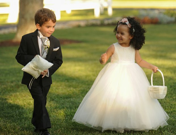 Below, Mr. Morrissey’s daughter, Kennedy, 3, shares a laugh as she starts her duties as flower girl with his 7-year-old nephew, John, the ring bearer.