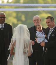 The couple’s son, 15-month-old Chase, was held during the ceremony by his father.