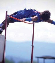 Kequan Henley goes up and over the bar to take the state high jump title last week in Harrisonburg. The Armstrong High School senior also placed fifth in the triple jump and ran a leg on the Wildcats’ 4x100 relay team, which placed fourth.