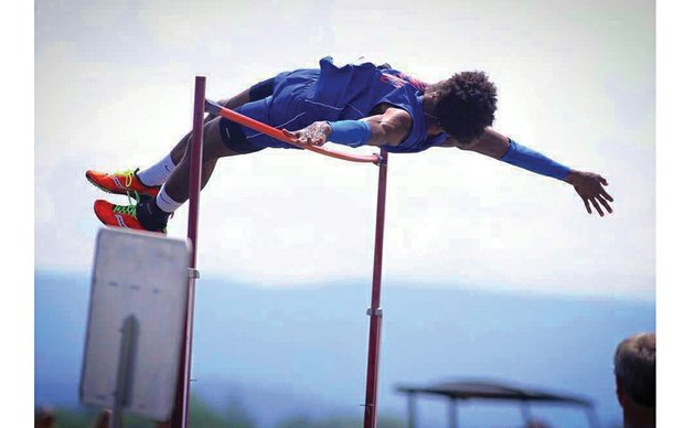 Kequan Henley goes up and over the bar to take the state high jump title last week in Harrisonburg. The Armstrong High School senior also placed fifth in the triple jump and ran a leg on the Wildcats’ 4x100 relay team, which placed fourth.