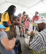 Family Day at VMFA//Dancers enjoyed the beats of the Afro Beta Drummers under a tent outside, while a member of the Harlem Chamber Players, right, entertained the crowd