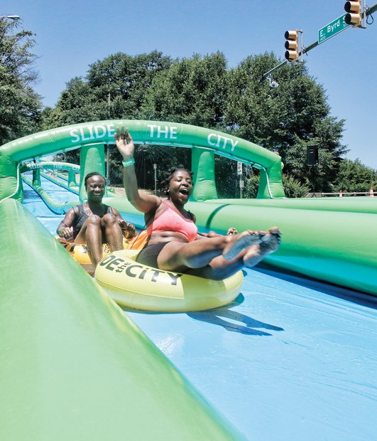  Big fun on the big slide on Byrd  // The weather was right for the event produced by Sack Lunch Productions. Employing the theme “the ultimate block party,” the event also featured food, music and street entertainers. A portion of the proceeds are going to Special Olympics Virginia.