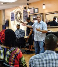 
Barbershop talk
Richmond Police Chief Alfred Durham tries a new outreach tactic — meeting people informally in a barbershop to hear their concerns. Minus his familiar uniform, he held the session last Saturday at the Celebrity Barber Lounge, 406 N. 1st St. in Jackson Ward. About 20 people turned out. Behind him, owner John R. Dean, who gave the chief the idea, puts the finishing touches on a customer’s cut.  