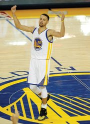 Below, Stephen Curry of the Golden State Warriors reacts when play stops in the second half of the title game against Cleveland. The Warriors played Game 7 on their home turf, the Oracle Arena in Oakland, Calif.
